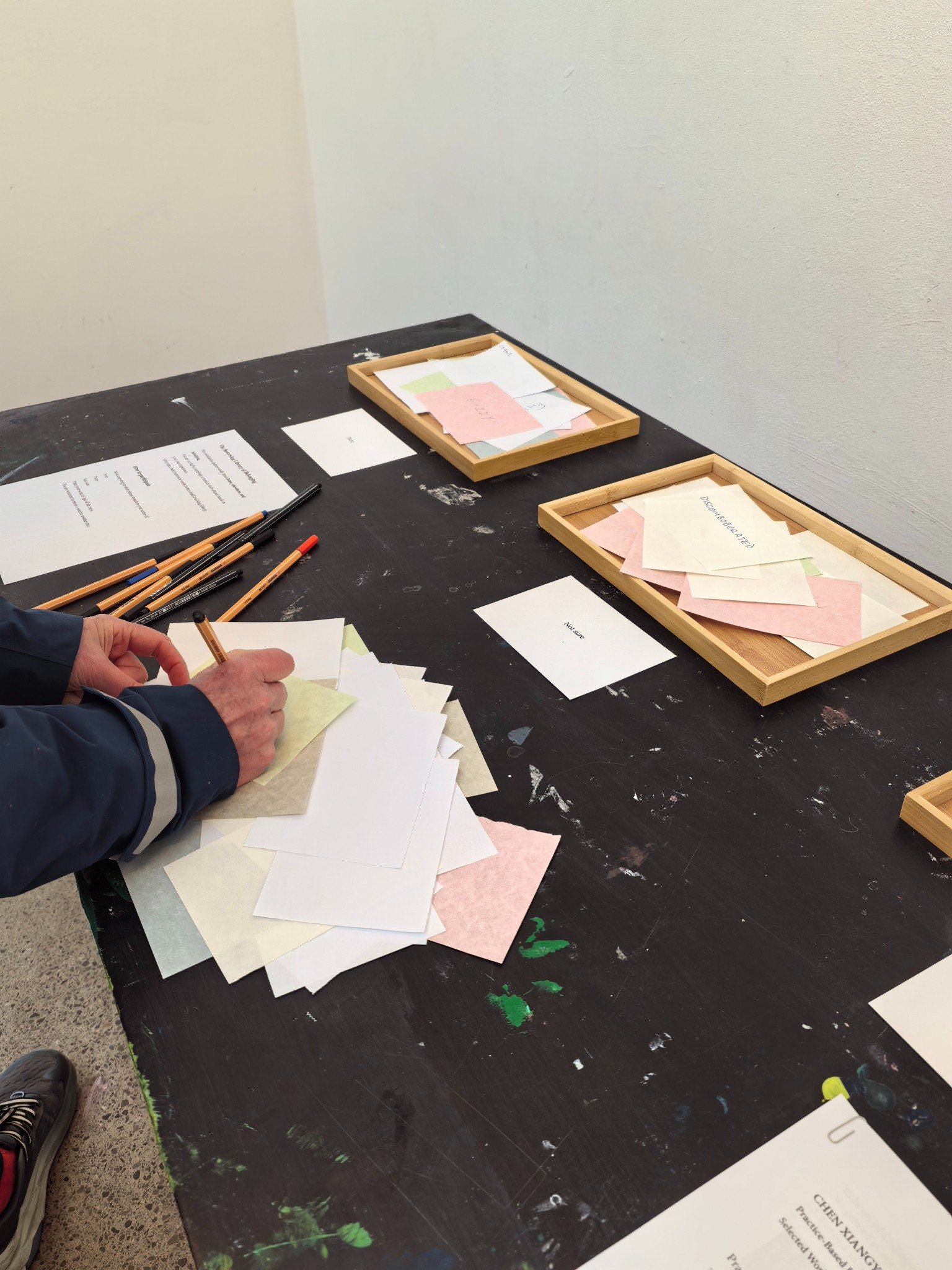 A visitor writes a contribution.