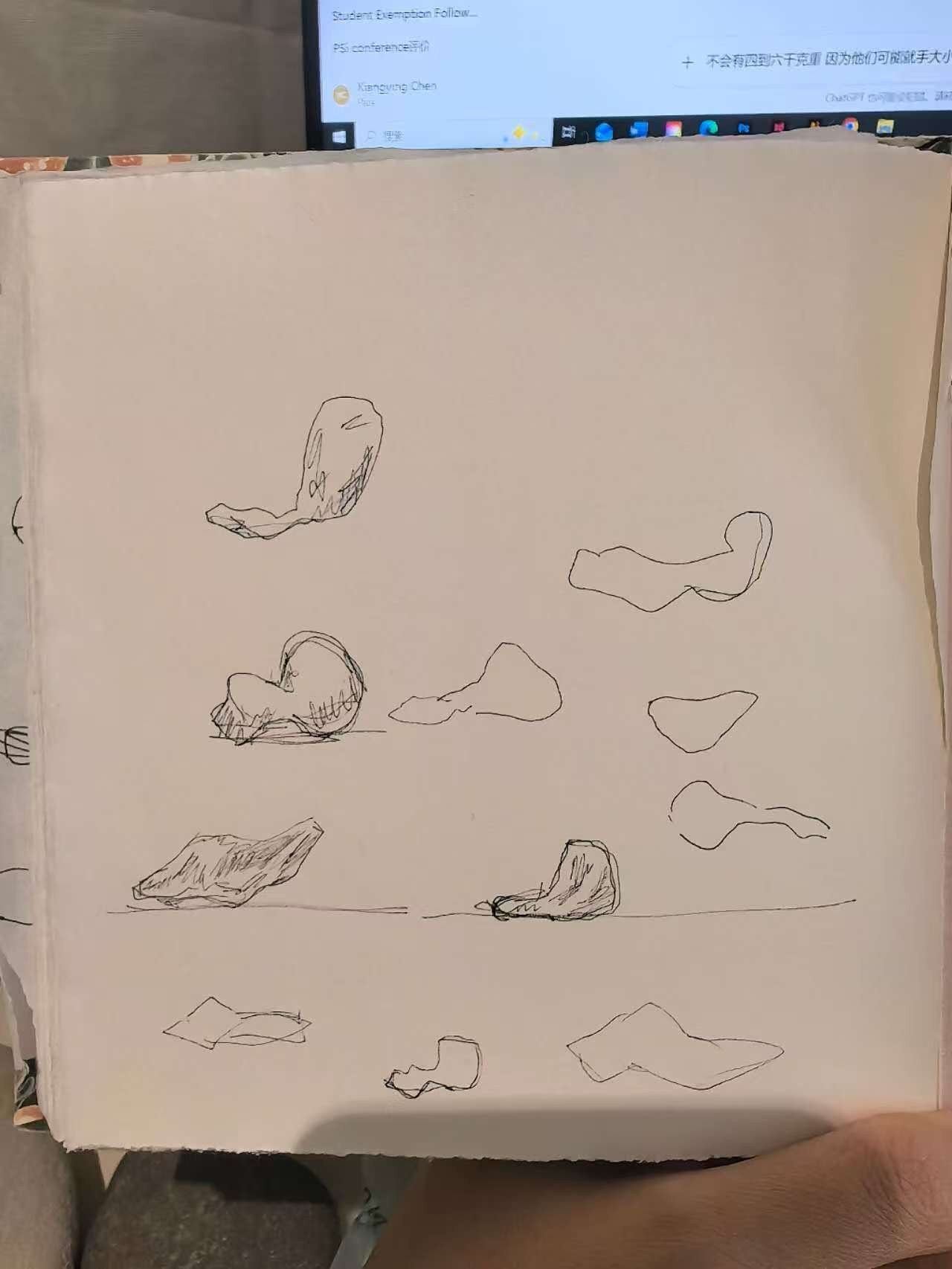 A sketchbook page containing studies for sculptural forms.